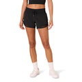 Amazon Essentials Women's Regular-Fit Athletic Ruched Waistband Woven Running Shorts with Zip Pocket, Black, Large