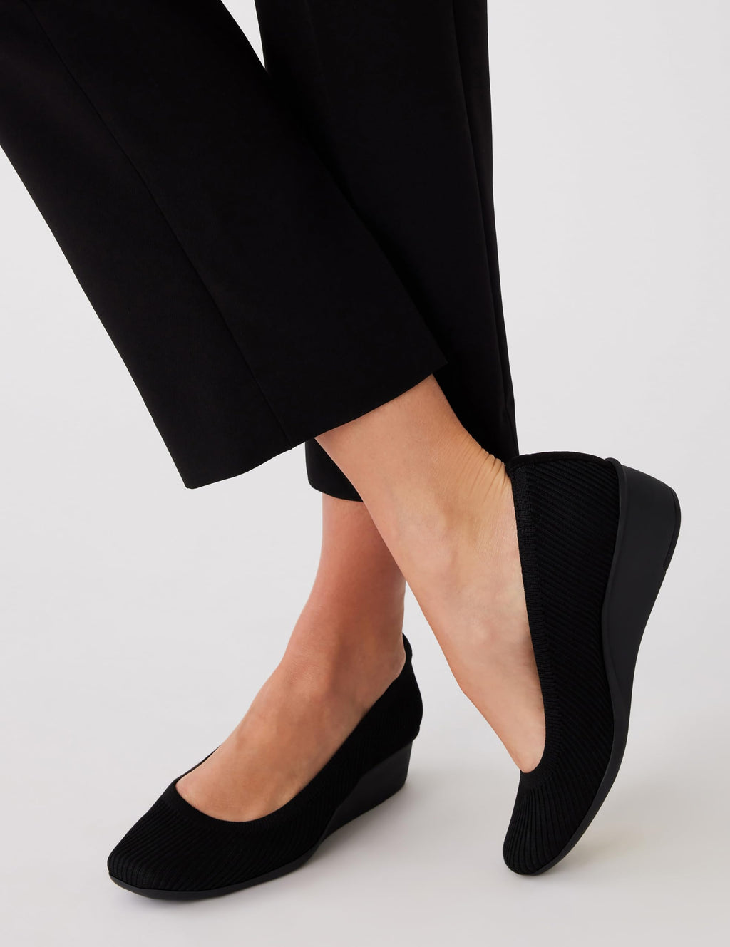 Anne Klein Women's Wisher Closed Toe Comfortable Slip-On Business Casual Pump Wedge, Black Knit, 9