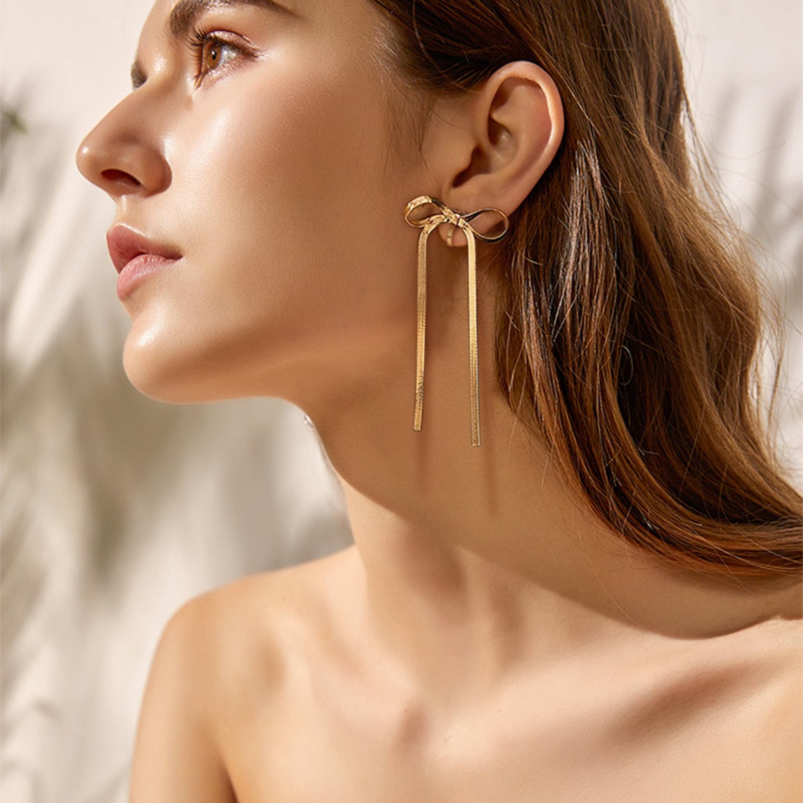 NVWAROCK Cilp-on Gold Bow Earrings Non Pierced Ribbon Bow Dangle Drop Tassel Statement Earring for Women 14K Real Gold Plated Dangling Long chain Earrings