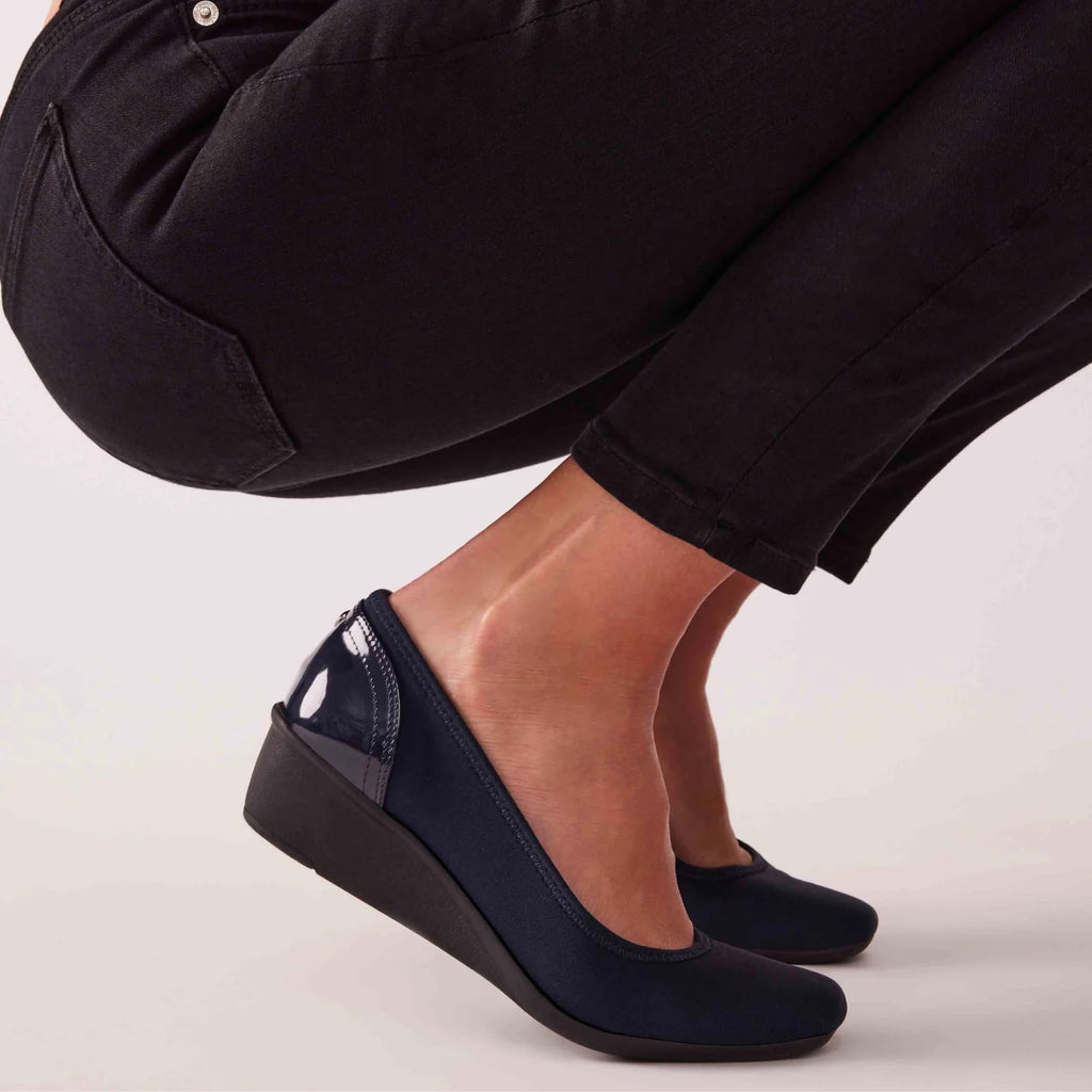 Anne Klein Women's Wisher Closed Toe Comfortable Slip-On Business Casual Pump Wedge, Black Knit, 9
