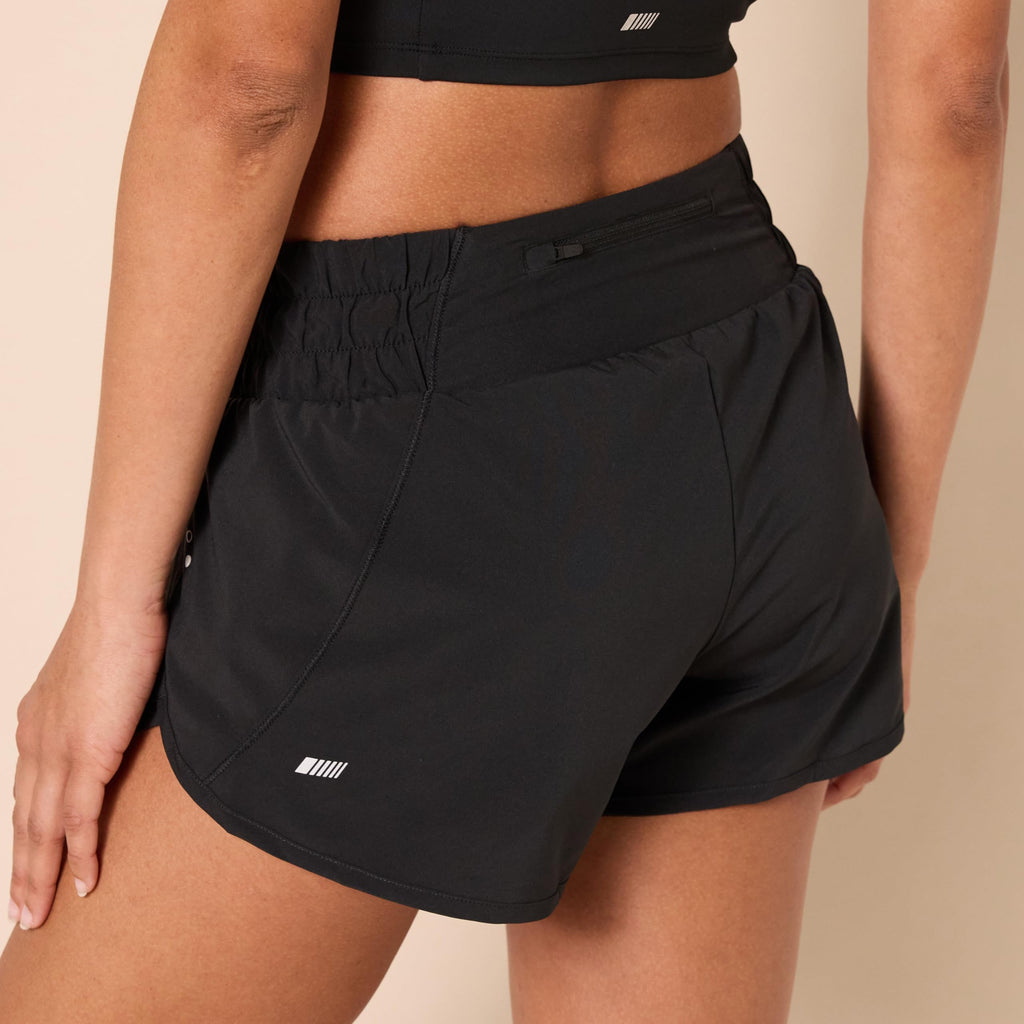Amazon Essentials Women's Regular-Fit Athletic Ruched Waistband Woven Running Shorts with Zip Pocket, Black, Large
