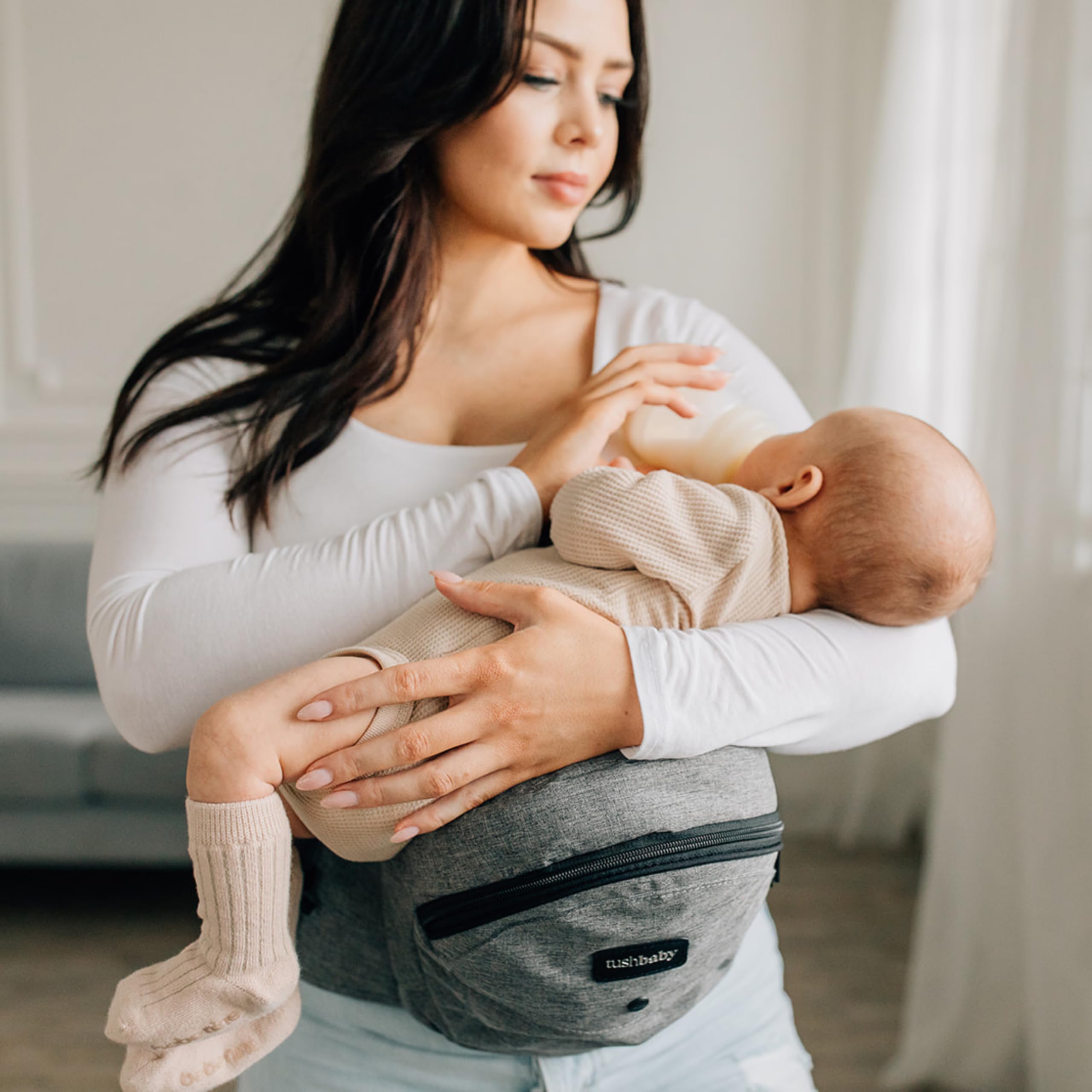 Tushbaby Original Hip Seat Baby Carrier for Babies & Toddlers up to 45 lbs, Safety Certified, Lightweight No-Foam Design with Storage & Nursing Support, Grey