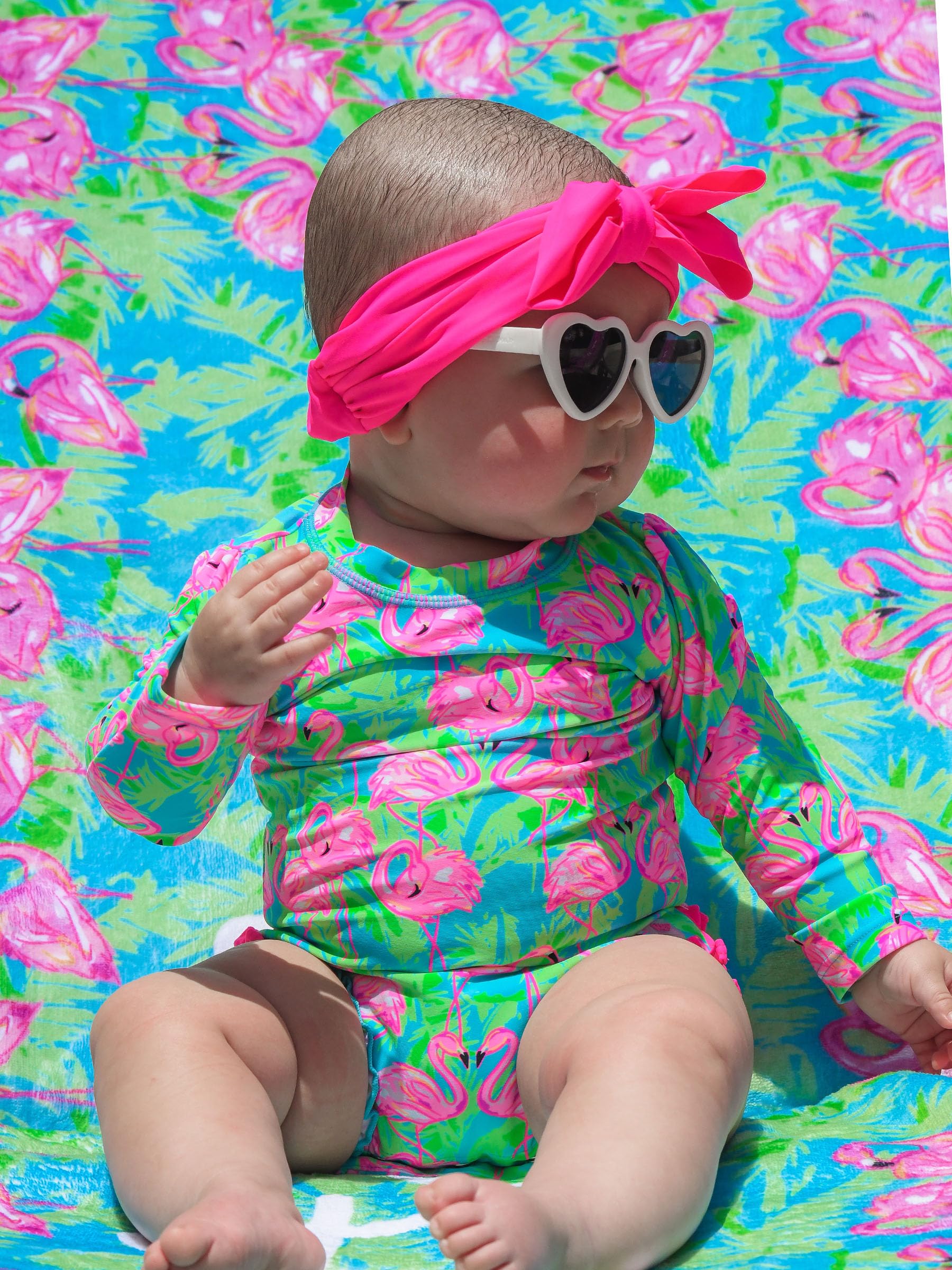 RuffleButts Baby Girls UPF 50+ Sun Protection Tropical Print Long Sleeve One Piece Rash Guard Swimsuit with Zipper - Neon Flamingo Fun, 12-18m